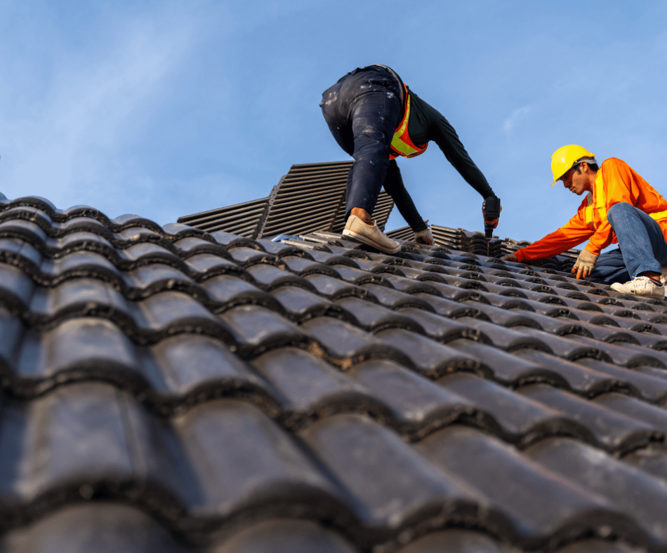 Roofing Contractors from Palmer Roofing hard at work installing a tile roof for a new home