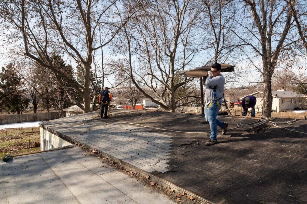Palmer Roofing team preparing a residential roof for new tile installation in Richland, WA, using industry-leading materials for superior results.