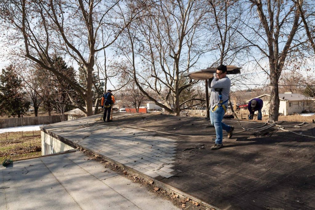 Palmer Roofing roofers working roof repair on a residential roofing project in Pasco, WA